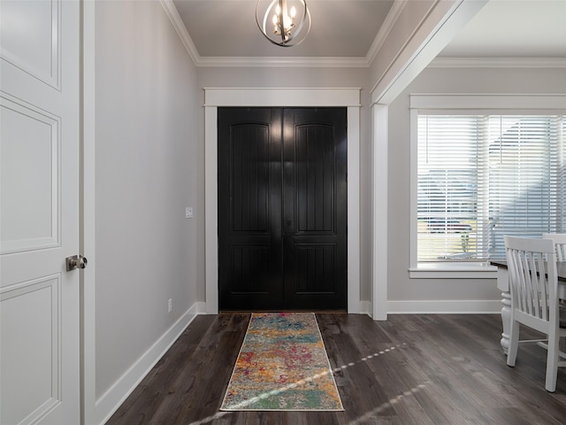 entrance foyer with dark wood-type flooring and ornamental molding