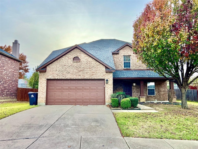 view of front of home with a garage and a front yard