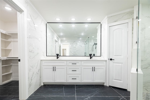 bathroom with vanity, walk in shower, crown molding, and tile walls