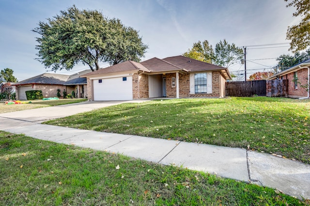 single story home with a garage and a front lawn