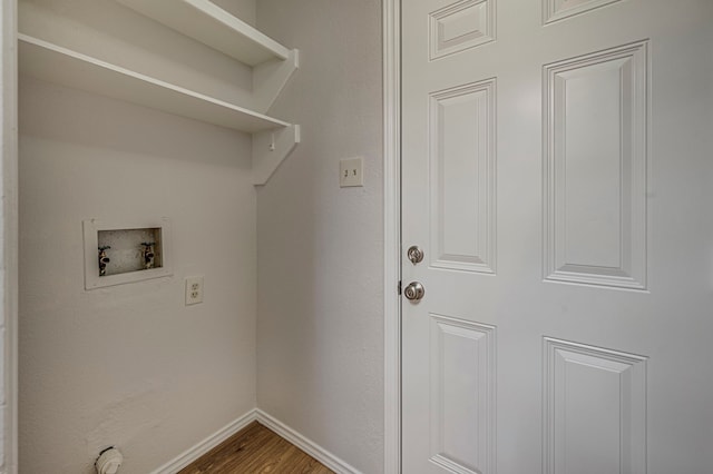 clothes washing area featuring washer hookup and hardwood / wood-style floors