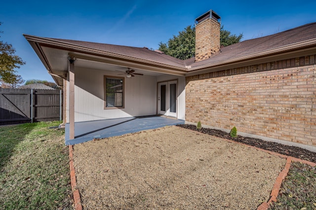 back of house featuring ceiling fan and a patio area