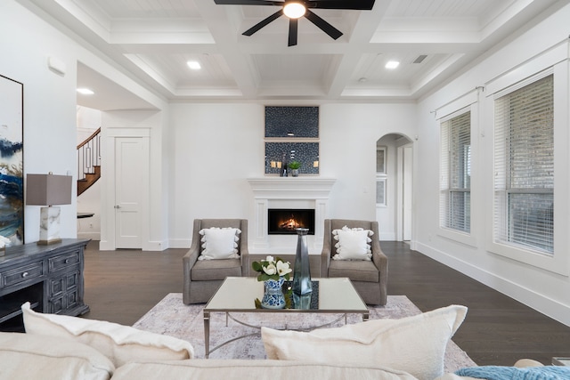 4509 Montalcino Blvd, Flower Mound, TX 75022 - living room with a ceiling fan, coffered ceiling, wood finished floors, beam ceiling, and arched walkways