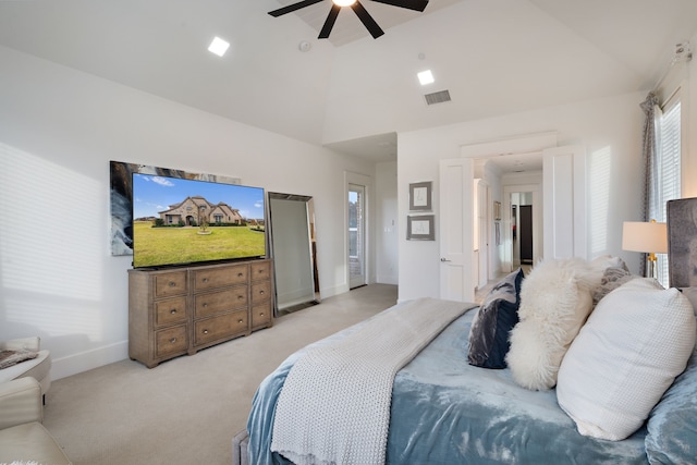 carpeted bedroom with high vaulted ceiling and ceiling fan