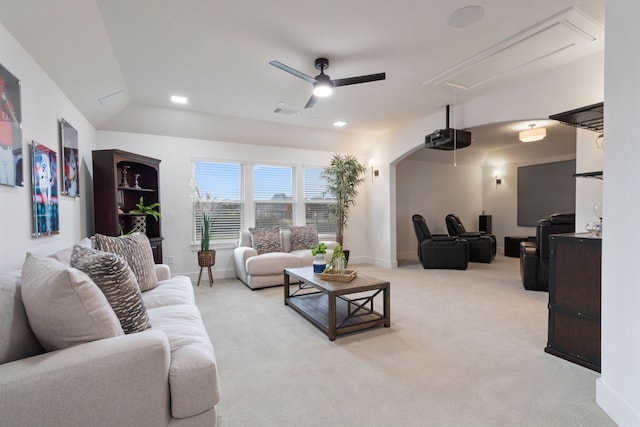 4509 Montalcino Blvd, Flower Mound, TX 75022 - living room featuring attic access, ceiling fan, light colored carpet, and arched walkways