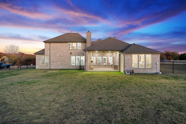 4509 Montalcino Blvd, Flower Mound, TX 75022 - rear view of house with a chimney, a patio area, brick siding, and a shingled roof