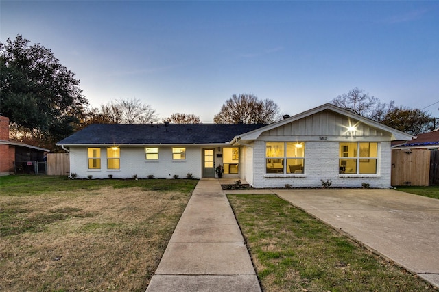 ranch-style house featuring a yard