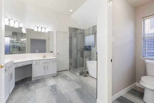 bathroom featuring toilet, a shower stall, baseboards, a freestanding bath, and vanity