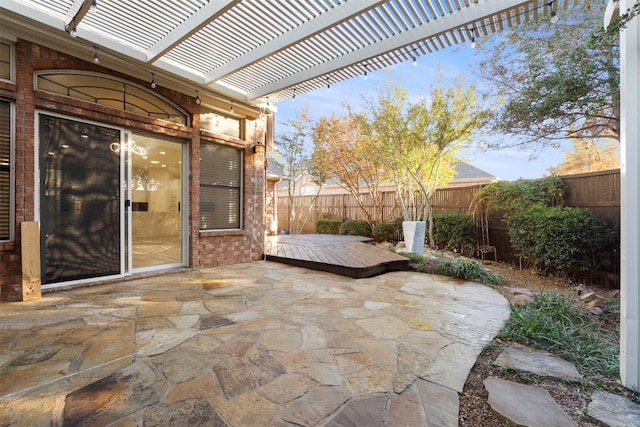 view of patio featuring a pergola and a wooden deck