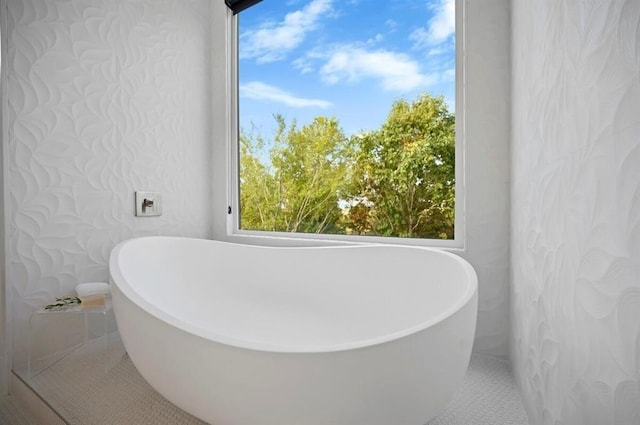 bathroom featuring a tub to relax in