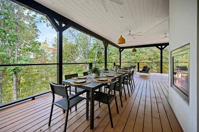 wooden terrace featuring ceiling fan