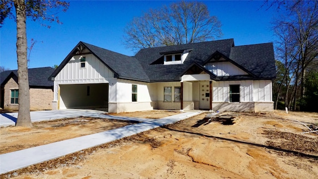 modern farmhouse style home featuring a garage