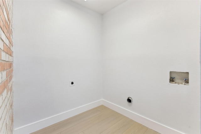 laundry room with hookup for an electric dryer, hardwood / wood-style floors, and hookup for a washing machine