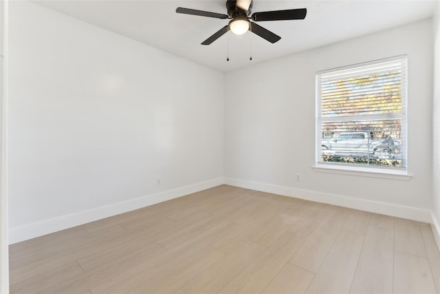 spare room featuring ceiling fan and light wood-type flooring