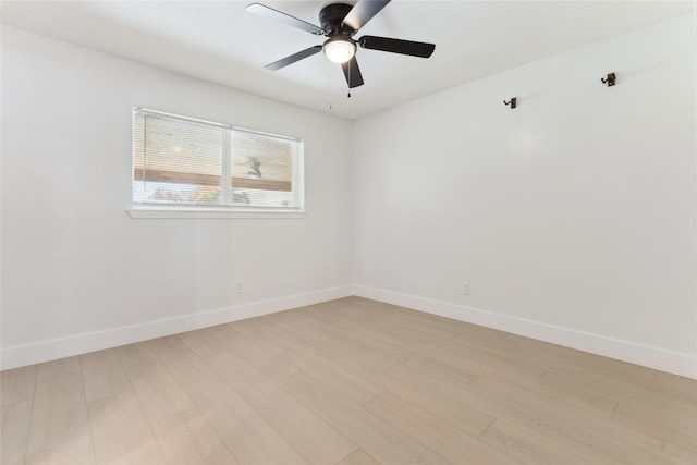 spare room with ceiling fan and light hardwood / wood-style floors