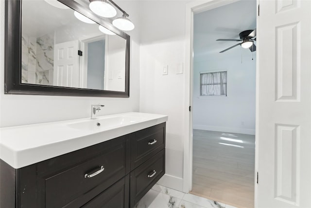 bathroom with ceiling fan and vanity