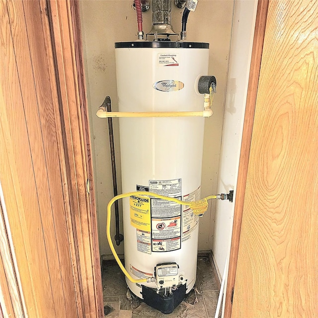 utility room featuring gas water heater