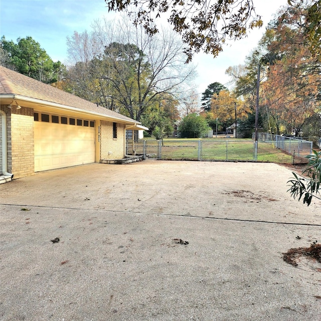 view of side of property with a garage