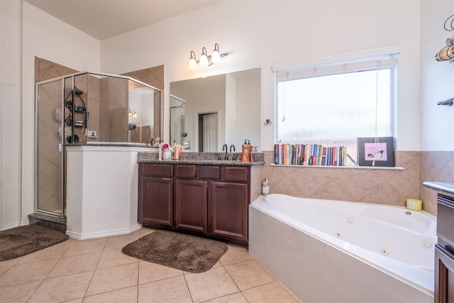 bathroom featuring tile patterned flooring, vanity, and independent shower and bath