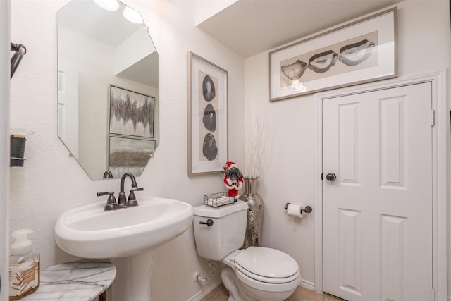 bathroom featuring sink and toilet