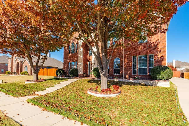 view of front facade featuring a front yard