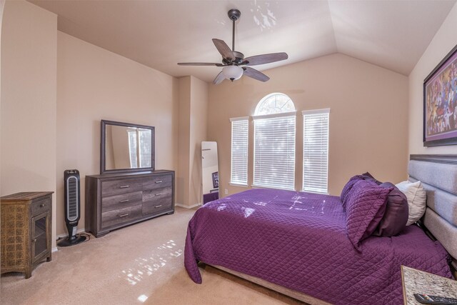 carpeted bedroom featuring ceiling fan and lofted ceiling