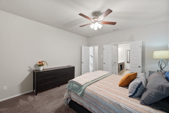 bedroom featuring visible vents, light carpet, connected bathroom, ceiling fan, and baseboards