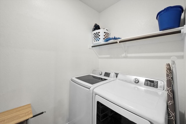 laundry area with laundry area and washing machine and clothes dryer