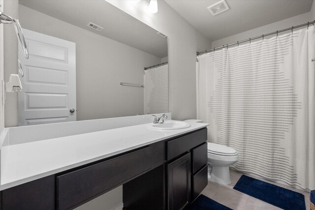 full bath featuring visible vents, vanity, toilet, and tile patterned floors