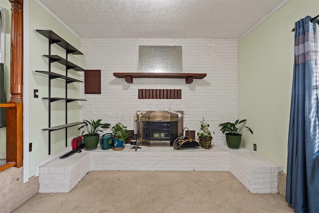 carpeted living room featuring crown molding and brick wall