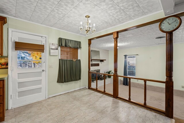 unfurnished room with crown molding and an inviting chandelier