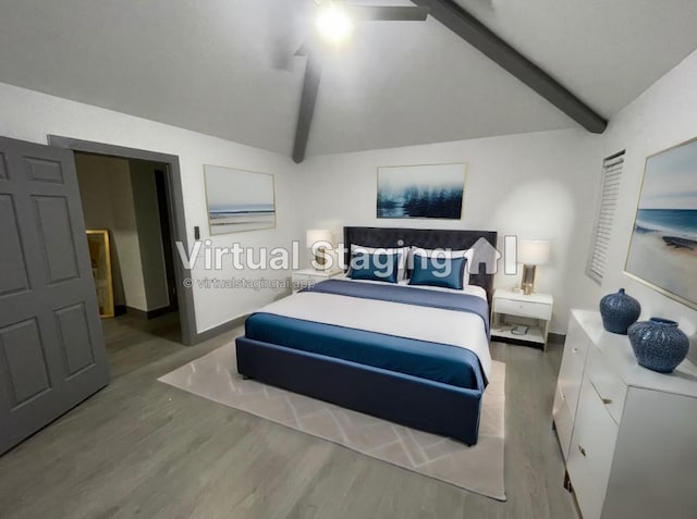 bedroom with hardwood / wood-style floors and lofted ceiling with beams