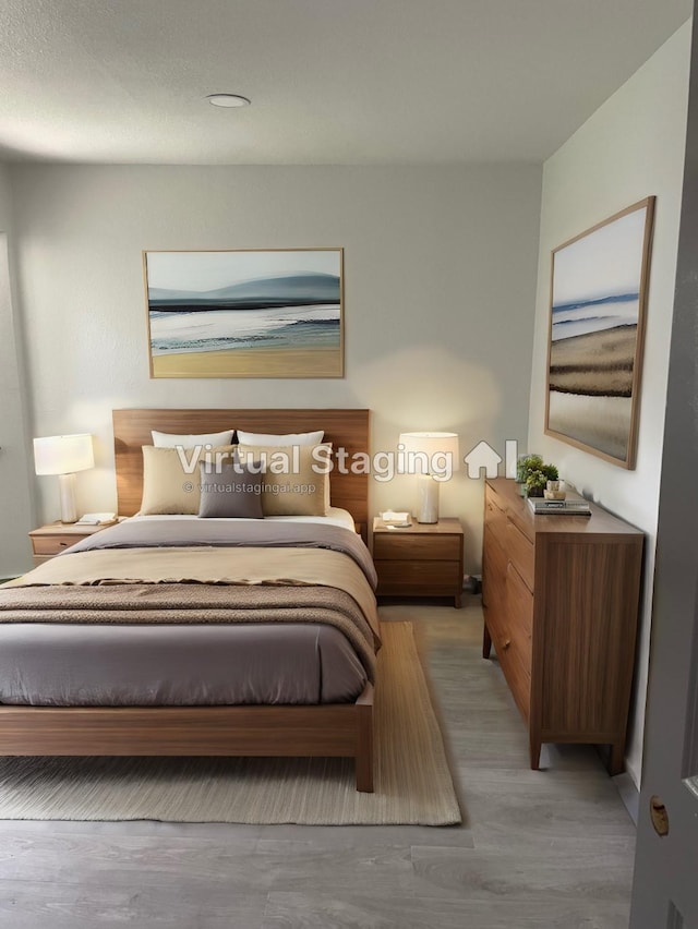 bedroom featuring light hardwood / wood-style floors