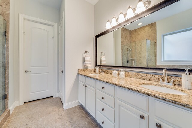 bathroom featuring vanity and a shower with shower door