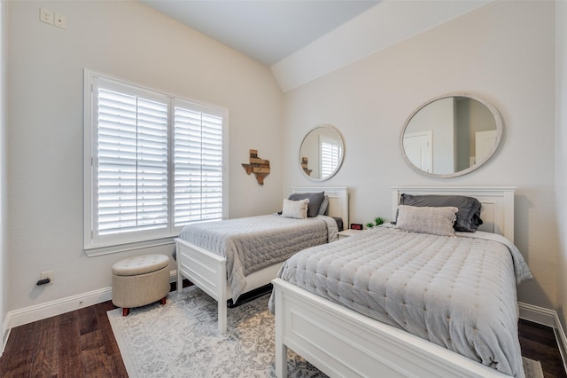 bedroom featuring vaulted ceiling and hardwood / wood-style flooring