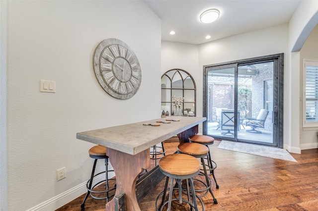 dining space featuring dark hardwood / wood-style flooring