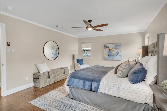 bedroom with wood-type flooring, ceiling fan, and crown molding