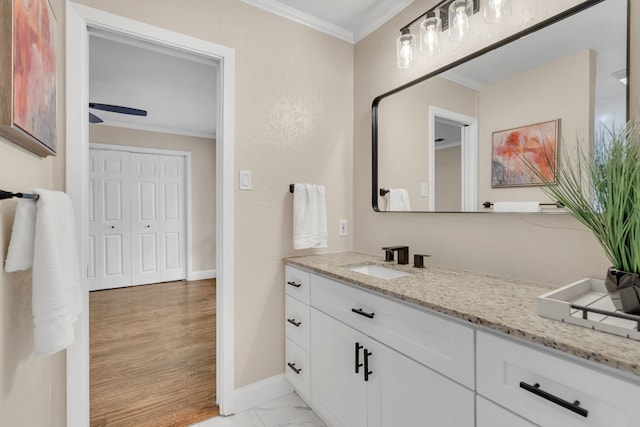 bathroom with vanity and crown molding