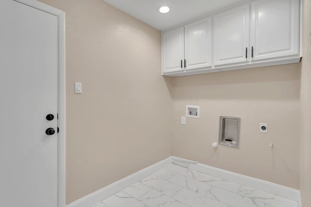 laundry room featuring electric dryer hookup, washer hookup, cabinets, and gas dryer hookup