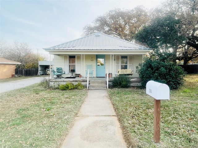 bungalow-style house featuring a front lawn and covered porch