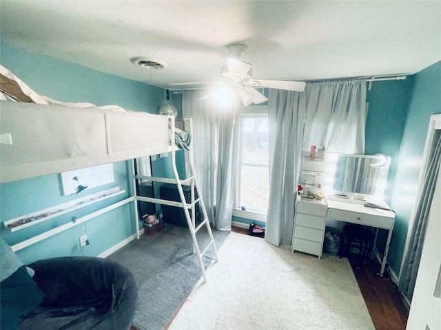 bedroom with ceiling fan and dark hardwood / wood-style flooring