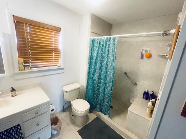 bathroom with toilet, tile patterned flooring, vanity, and walk in shower