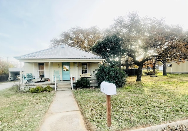 bungalow-style home featuring a front lawn and a porch