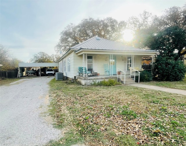 bungalow-style house featuring central AC and covered porch