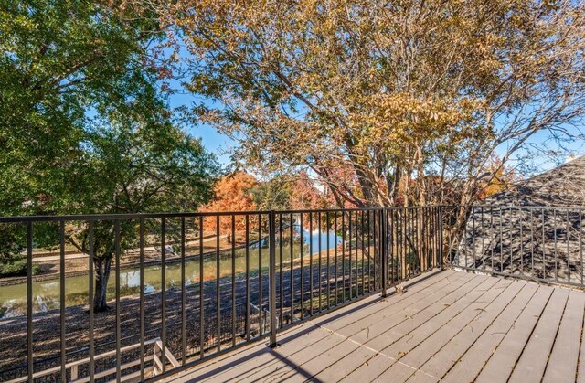 wooden terrace with a water view