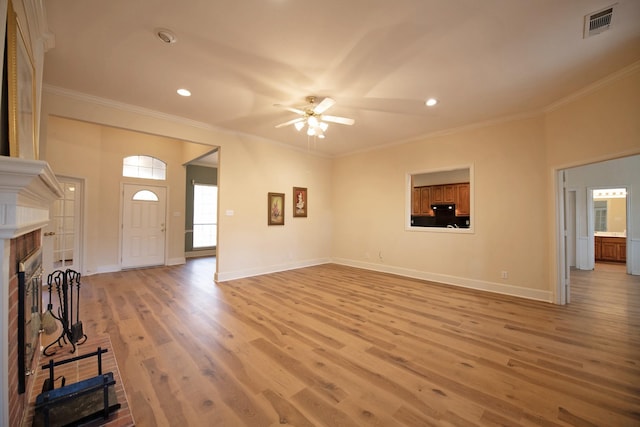 foyer with ceiling fan, light hardwood / wood-style floors, and ornamental molding