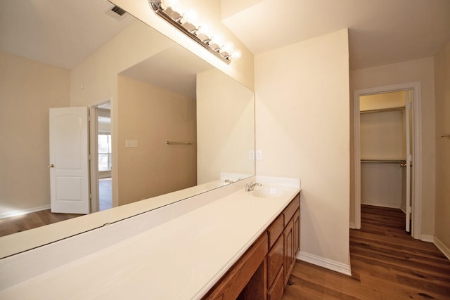 bathroom with vanity and wood-type flooring