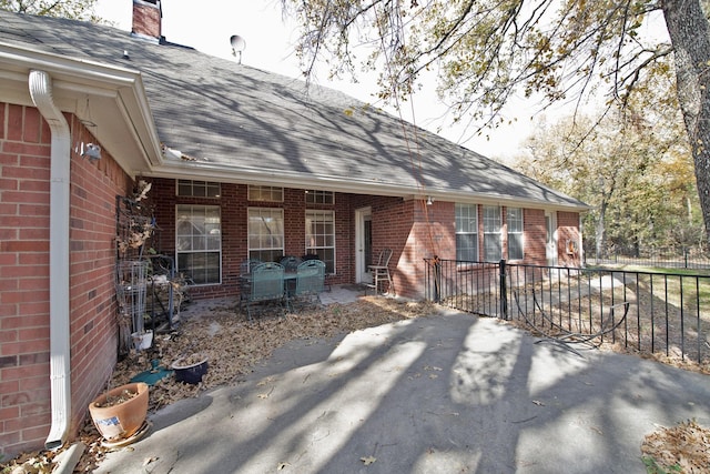 rear view of property featuring a patio area