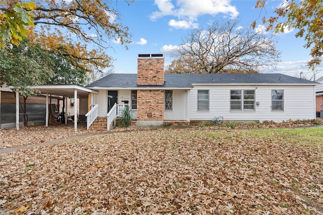 view of front facade with a carport