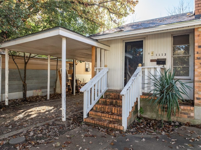 property entrance with a carport